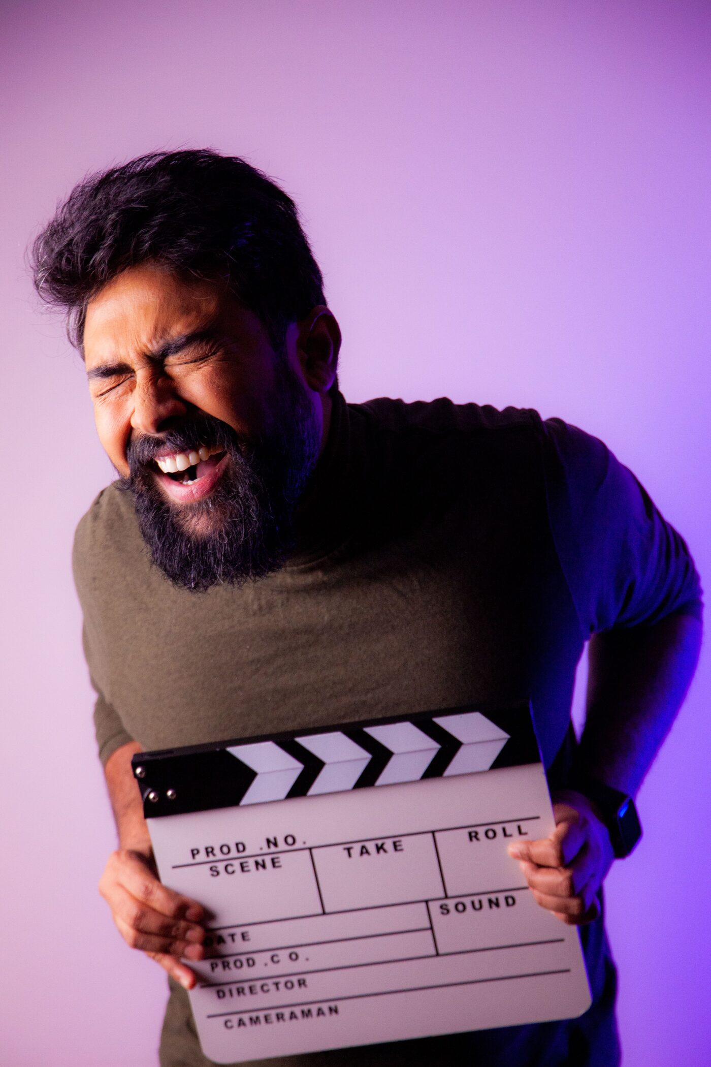 Actor on a Krakatoa set holding a production clapperboard